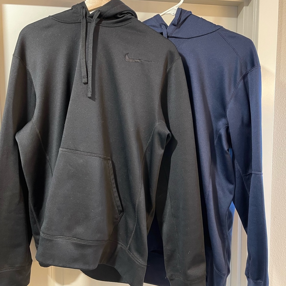 Nike Therma Fit hoodies. sold as a set. One is blue and one is black